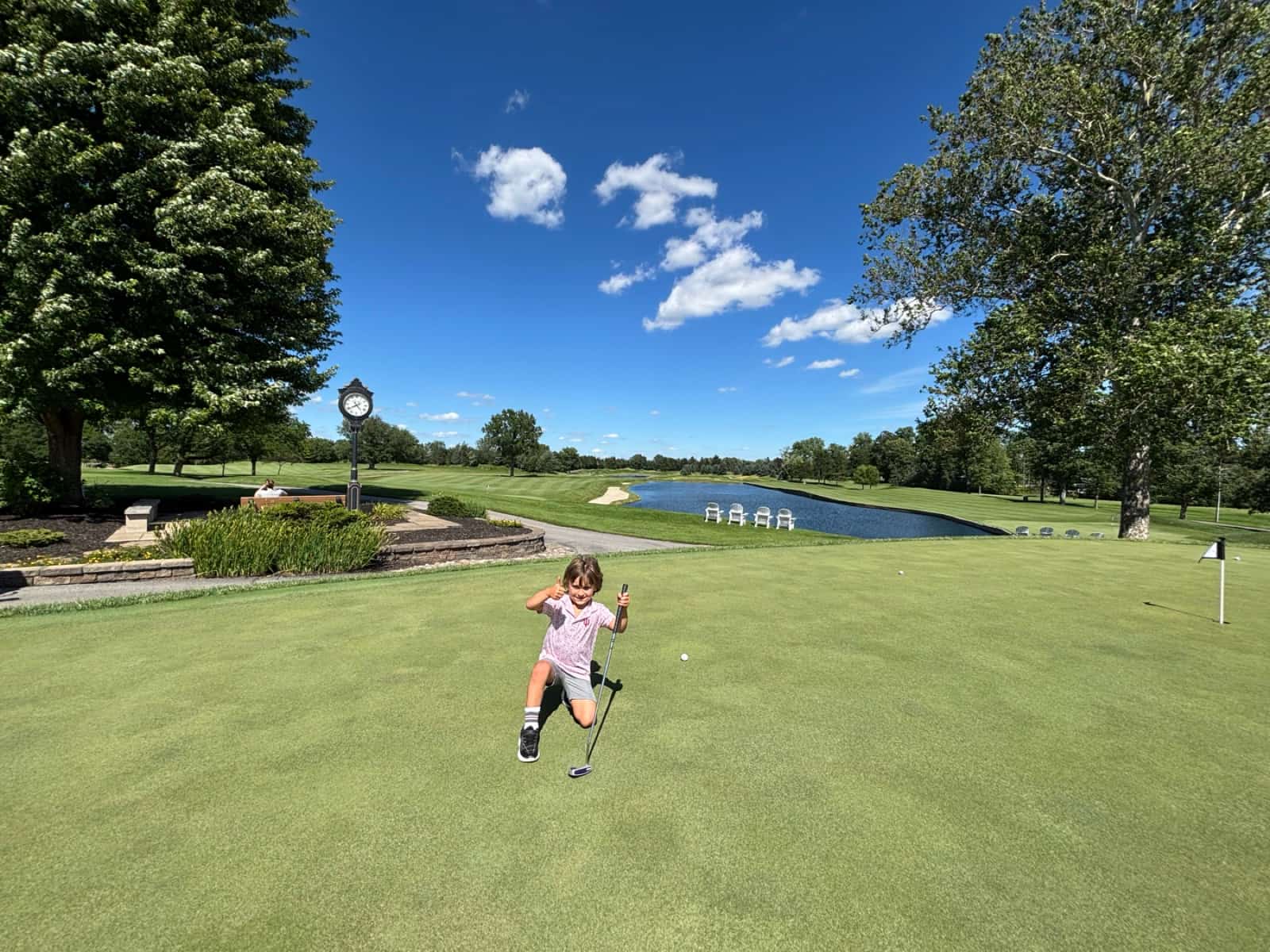 Cody on the putting green at River Glen, giving a thumbs up